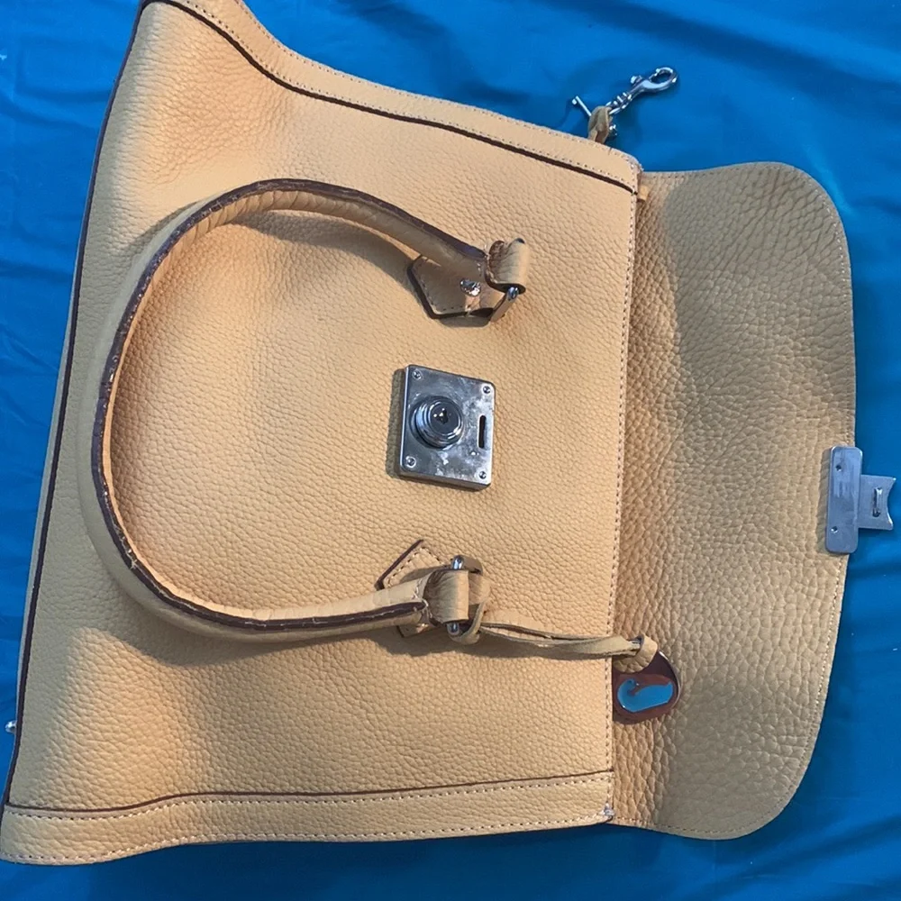 Almost New Dooney and Bourke Satchel with matching wallet. Rich Mustard Color